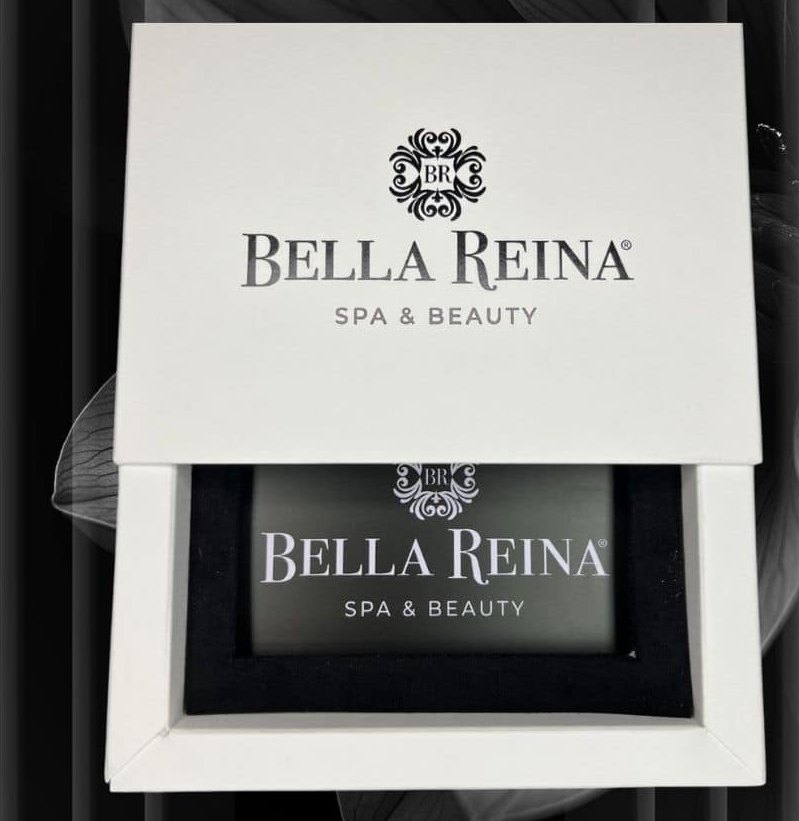 A Bella Reina gift card in its signature white box, the lid slid back to reveal the black card sitting on black velvet inside