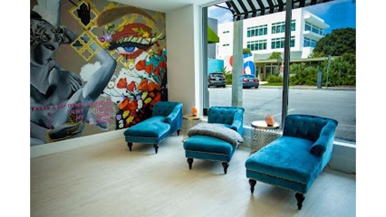 The teal pedicure lounge at Bella Reina Spa
